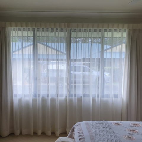 Soft voile sheer curtains reverse pleat hemmed double track lining