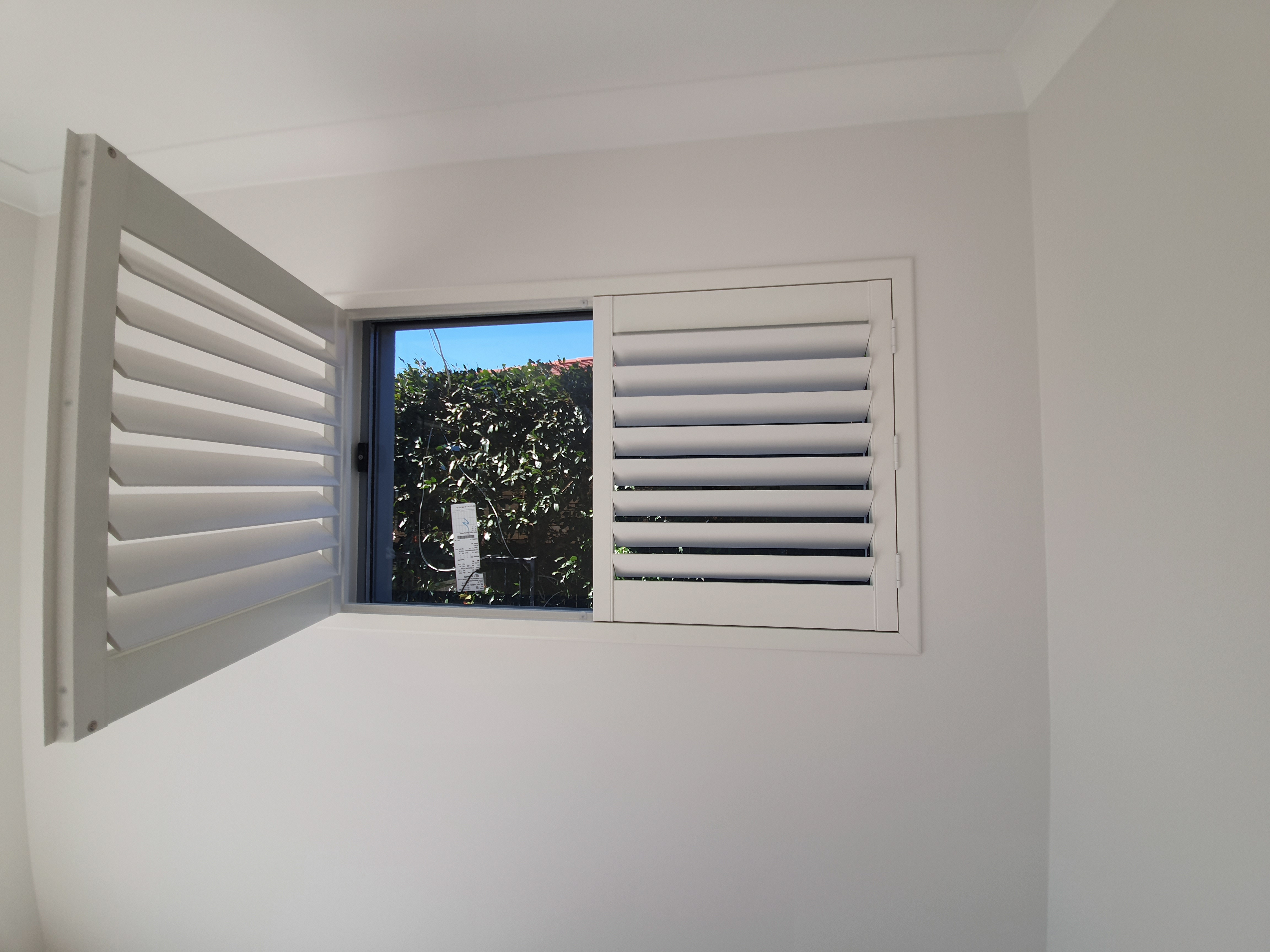 White eco timber-look shutters hinged panel frame