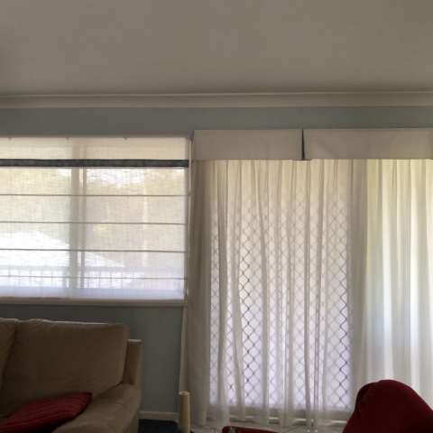 Soft roman blinds with matching curtains and valances